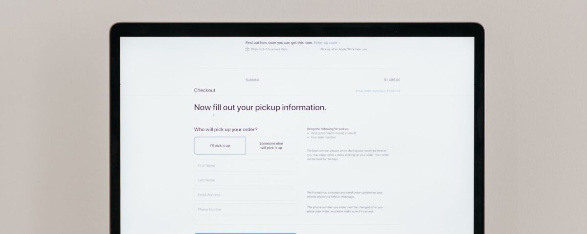 A laptop displaying an online checkout form, highlighting technology and e-commerce.