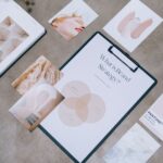 Flat lay showing branding materials and design concepts for creative strategy discussions.