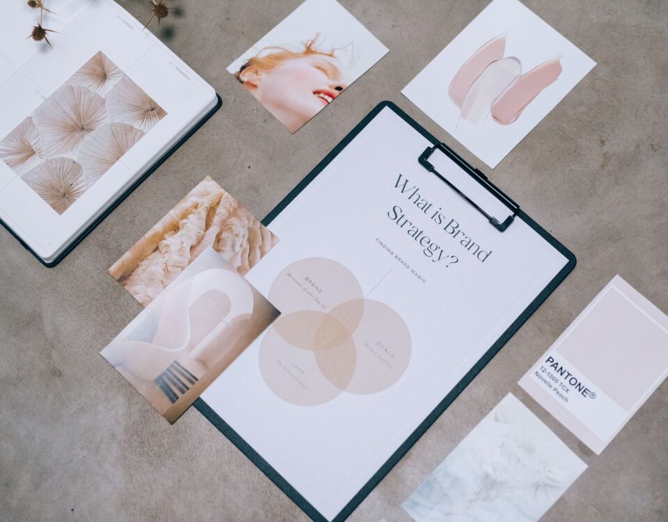 Flat lay showing branding materials and design concepts for creative strategy discussions.