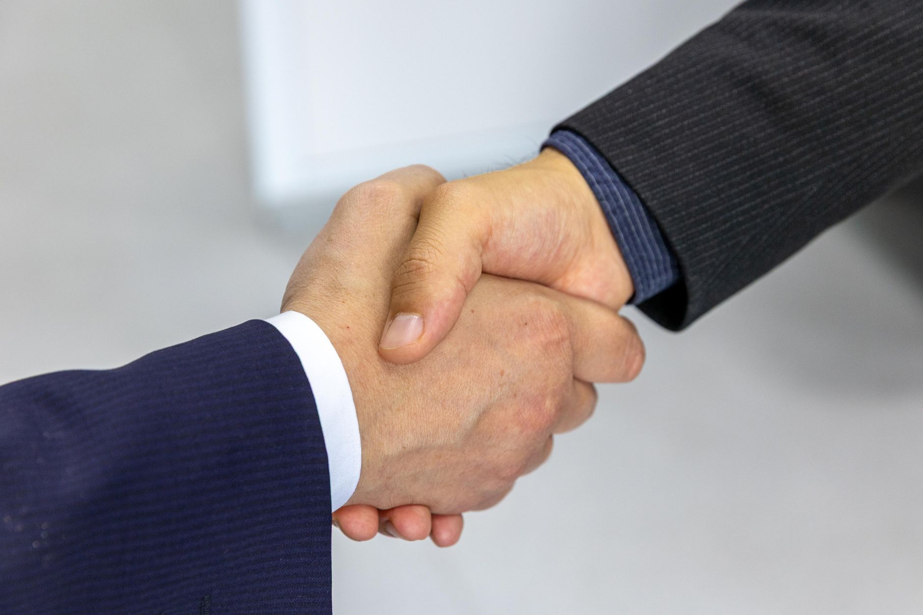 Business partnership handshake after agreeing an SEO strategy in Dubai